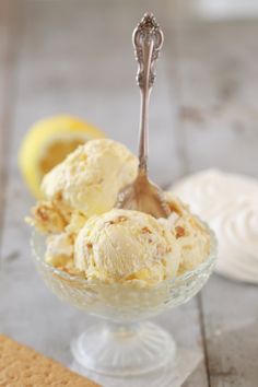 two scoops of ice cream in a glass bowl