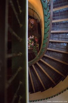 a spiral staircase with flowers in the center