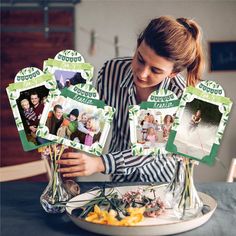 a woman sitting at a table in front of a plate with flowers and pictures on it