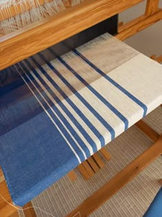 a weaving machine with blue and white stripes on it