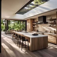 a large kitchen with an island counter top and lots of stools in front of it