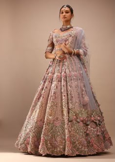 a woman in a pink lehenga with floral print on the skirt and blouse