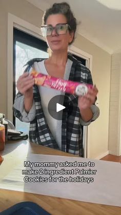 a woman holding up a pink candy bar in front of her face with the caption, my mommy asked not to make 2 ingredient palmer cookies for the holidays