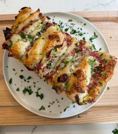 a white plate topped with slices of pizza