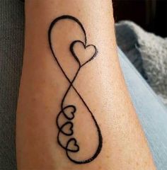 a tattoo on the arm of a woman with two hearts and an infinite love knot