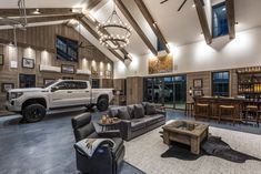 a living room filled with furniture and a large ceiling mounted clock hanging from the ceiling