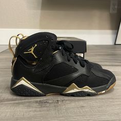 Black And Metallic Gold Air Jordan 7s. Some Cracking On Soles As Pictured Above Due To Wear Over Time! Jordan 7s, Jordan Retro 7, Retro 7, Golden Moments, Air Jordan Retro, Shoes Air, Kids Jordans, Air Jordans Retro, Jordan Retro