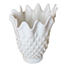 a white vase is shown on a white background