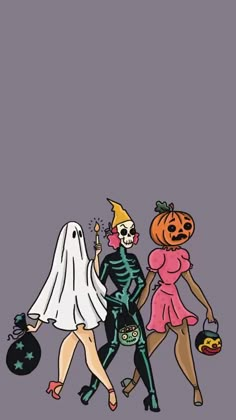 three people in halloween costumes walking down the street