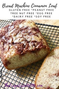 a loaf of bread sitting on top of a cooling rack next to a slice of cake