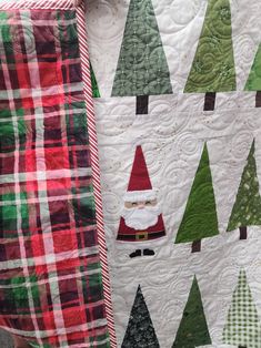 a quilted christmas tree with santa clause on it