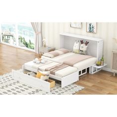 a white bed sitting on top of a hard wood floor next to a wooden dresser