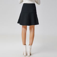 This minimalist short skirt features an adjusted cut on the hips and a flared yoke down to the hem. To wear with the associated jacket: an ensemble that is suitable for professional or semi-formal occasions, for a polished look and a refined style. Main material: 55% Polyester, 45% Wool. Lining: 95% Polyester, 5% Elastane.  Washing temperature 30° maximum in delicate cycle. Low ironing temperature / bleaching prohibited. Do not tumble dry. Modern A-line Skirt For Workwear, Elegant A-line Skort For Workwear, Elegant A-line Skort For Work, Fitted Mini Skirt With Pleated Hem For Work, Elegant Mini Skirt With Pleated Hem For Fall, Workwear Mini Skirt With Pleated Hem, Fitted Skirt With Pleated Hem For Fall, Fall Fitted Skirt With Pleated Hem, Fitted Pleated Mini Skirt For Fall