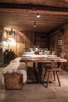 a wooden table and chairs in a room