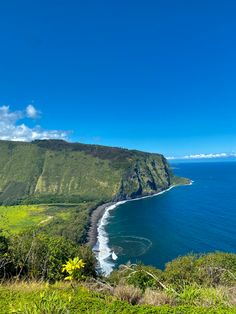 the ocean and mountains are seen from above