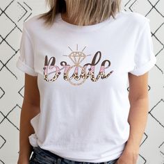 a woman wearing a white t - shirt with the word bride printed in leopard print