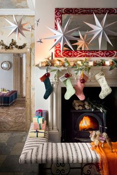 a fireplace with stockings hanging from it's mantle