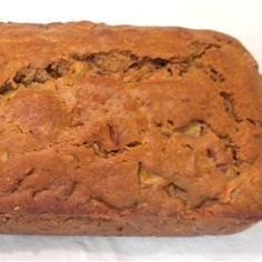 a loaf of bread sitting on top of a white table