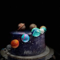 an image of a cake with planets on it