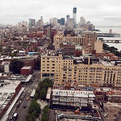 an aerial view of a city with lots of tall buildings