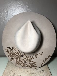 "We love our modern country brides! We design unique hats with our beautiful brides in mind, this is the perfect modern country accessory to wear on your big day and beyond! This hat is perfect for the bride who loves minimal custom design! The perfect hat for every season of weddings. These hats are felt/wool with a wide, flat brim.  Sizes vary for different colors. For Cream and Silverbelly sizes are small, medium, and large. Ivory hats are one size fits all. Hats come in four colors; Cream, S Bride Felt Hat, Burned Wedding Hat, Western Wedding Hat, Bridal Cowgirl Hat, Custom Wedding Hats, Western Style Wedding Hat With Flat Brim, Western Style Flat Brim Wedding Hat, Western Flat Brim Wedding Hat, Western Fedora Hat For Wedding