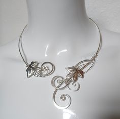 This is a handmade elven inspired collar torc necklace made with thick sterling silver plated metal over pure copper with  Intricately shaped and hammered curls with detailed ivy leaves. The necklace is made adjustable to fit most sizes but if you would like it made to your measurements I can do that too for no extra cost. This can also be made in gold brass and copper. Torc Necklace, Ivy Necklace, Elven Necklace, Elven Wedding, Ivy Leaves, Statement Collar, Brass And Copper, Ivy Leaf, Handmade Brass