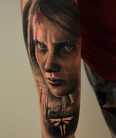 a person with a tattoo on their arm that has a woman's face painted onto it