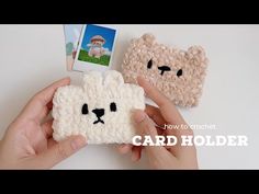 someone is holding up two small crocheted polar bear cell phones, one in white and the other in beige