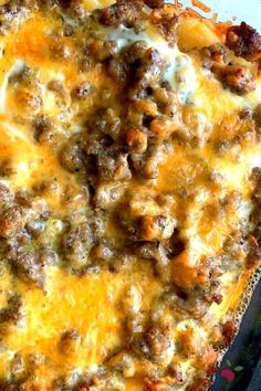 a casserole dish with meat and cheese on it