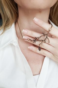 Copper Necklace made with an oversized twig pendant that looks like an enchanted branch and a cute detailed pinecone charm { D e s c r i p t i o n } This necklace is for nature lovers, that appreciate some woodland flair, mixed with modern simplicity. A large branch pendant, with an old tone copper color that hangs from a dark copper chain. The look is completed by a cute pine-cone pendant. The organic shape makes it a tribute to nature's beauty. It closes with a lobster clasp and it has an adju Deer Antler Jewelry, Enchanted Woodland, Pinecone Pendant, Antler Jewelry, Antler Necklace, Branch Necklace, Dark Copper, Woodland Forest, Copper Necklace