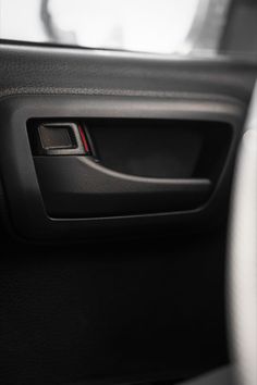 the interior of a car with buttons and steering wheel