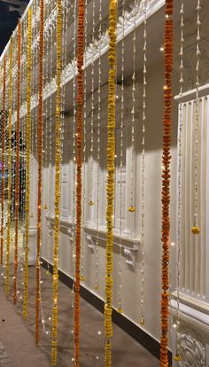 many orange and yellow garlands hanging from the ceiling