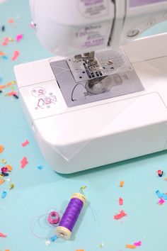 the sewing machine is next to confetti sprinkles