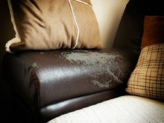 a couch that has some pillows on top of it and the words repairing faux leather upholstery