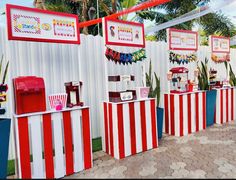 some red and white striped booths with food on them