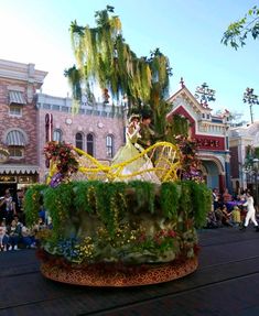 the float is decorated with flowers and greenery