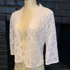 Perfect For A Wedding/Event Over Sleeveless Or Strapless, This Piece Is A Cardigan Jacket Style In A Beautiful White Lace. 3/4 Length Sleeves. No Buttons Or Snaps Or Zippers. Will Fit Size 4-6 Elegant White Open Front Cardigan, Elegant Open Front Summer Shrug, Elegant Fitted Spring Cardigan, Elegant Fitted Cardigan For Weddings, White Chic Fitted Shrug, Elegant White Fitted Cardigan, Elegant Stretch Cardigan For Party, Elegant Fitted Cardigan, Elegant Spring Stretch Cardigan