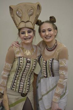 two girls in costume posing for the camera