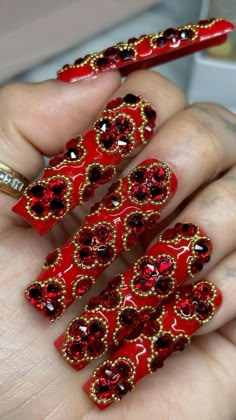 red van cleef inspired nails by @nailsby_sheila on instagram Painting Of Nails On Canvas, Long Red Nails Design, Van Cleef Nail Design, Queen Of Hearts Nails Acrylic, Red Charm Nails, Red Bling Acrylic Nails, Virgin Mary Nails Designs, Long Valentines Nails, Van Cleef Nails