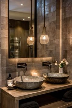 a bathroom with two sinks and a large mirror above it's countertop area