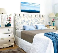 an image of a bedroom with white and blue decor