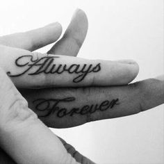 someone has tattooed their fingers with the words alwayss and forever on them, so they can