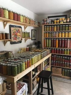 a store filled with lots of different types of jars and containers full of food on wooden shelves