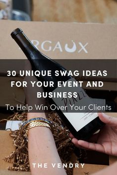 someone holding a wine bottle in their hand with the words 30 unique swag ideas for your event and business to help win over your client's