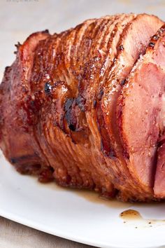 a close up of a plate of food with meat on it and the words honey baked ham