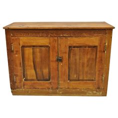 an old wooden cabinet with two doors