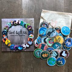 a bag with some buttons on it next to a bunch of magnets that say god with us