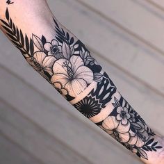 the arm is decorated with black and white flowers