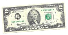 a one dollar bill with two dollars on it