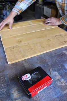 a man working on a piece of wood